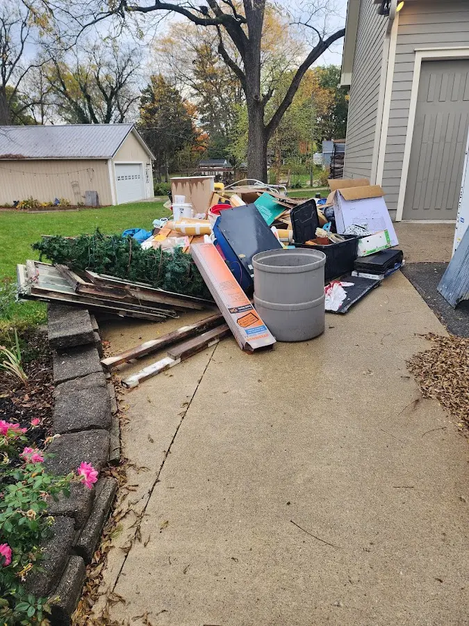 Dumpster being loaded with debris for 30 Yard Dumpster Rental in Noblesville